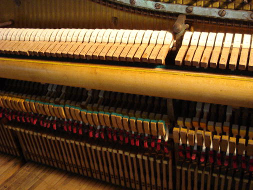 39 - Re-install reconditioned action in piano.